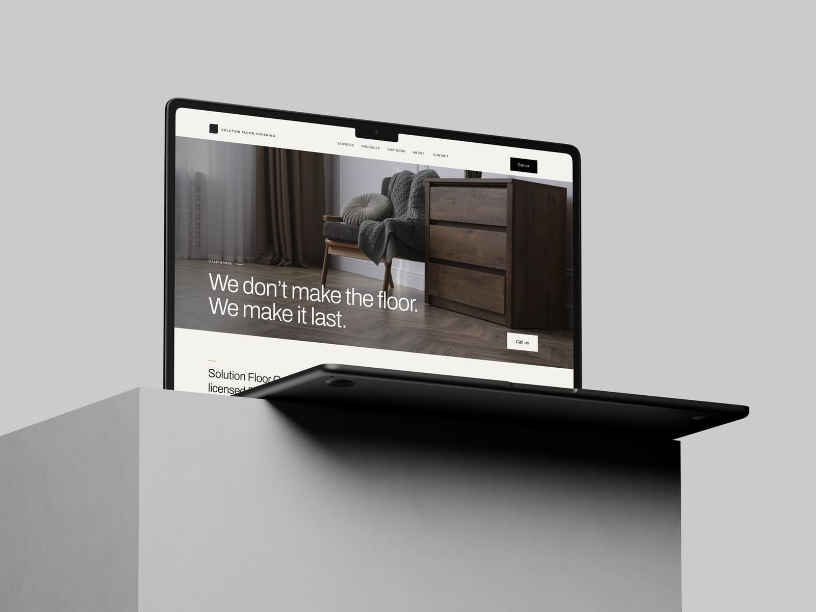 Solution Floor Covering website shown on a laptop